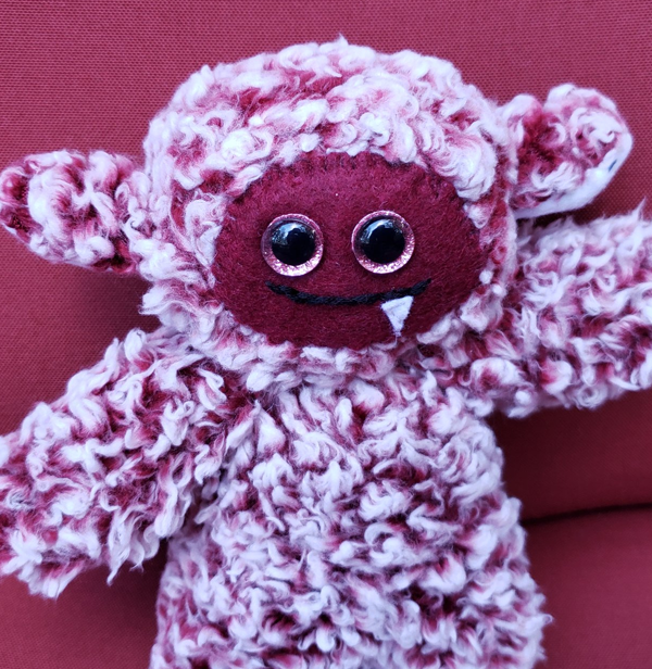 One-Fanged Red Cozy Monster