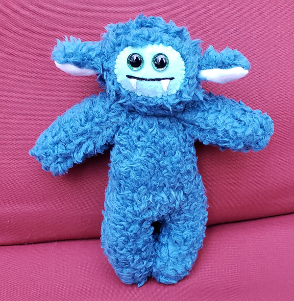Two-Fanged Teal Cozy Monster